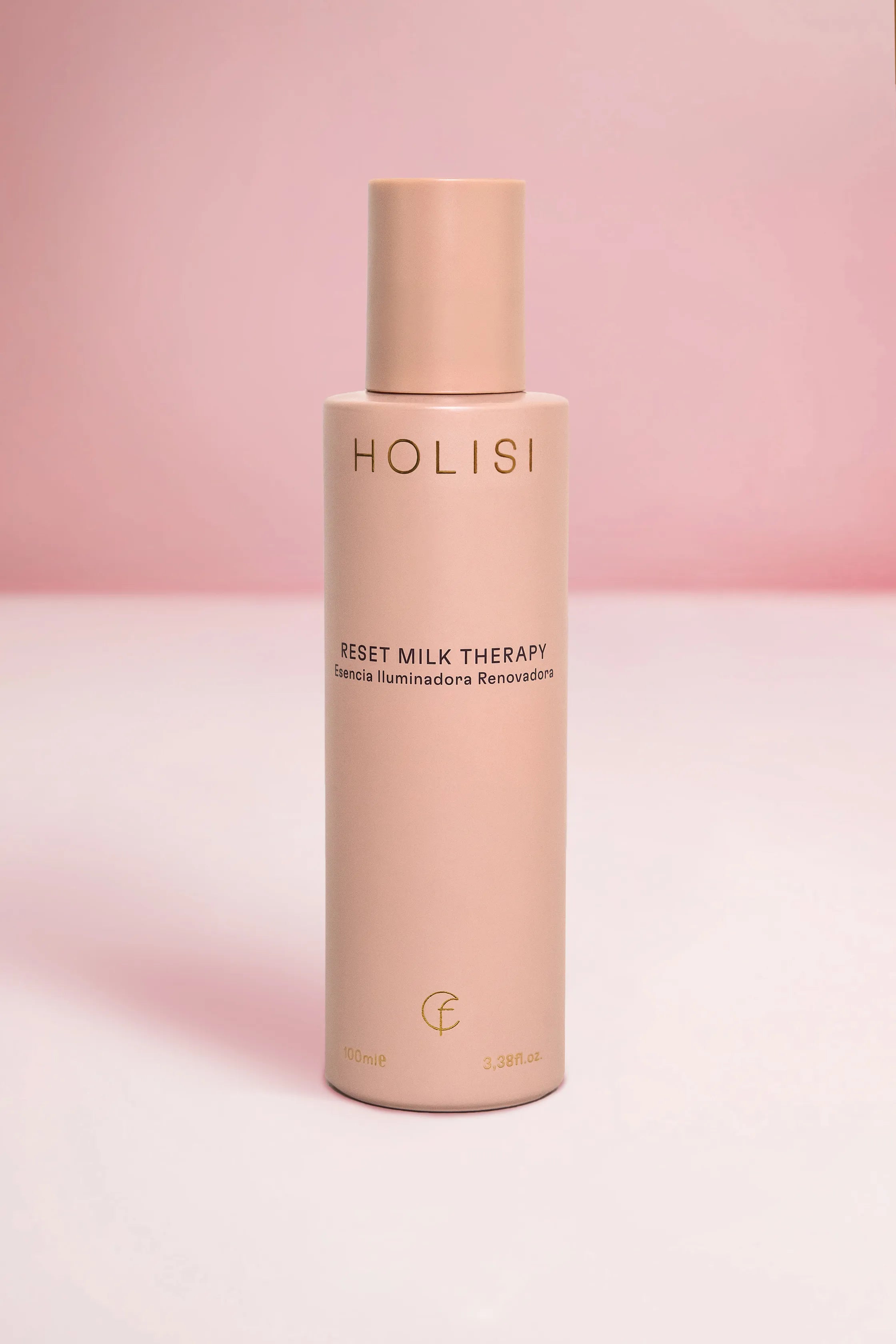 Envase de The Reset Milk Therapy sobre un fondo rosado